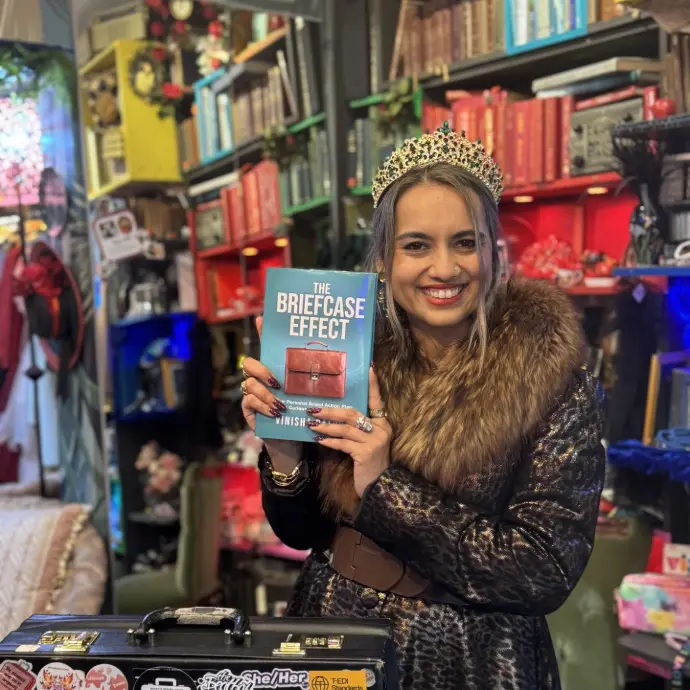 Vinisha Rathod holding her book at private book launch